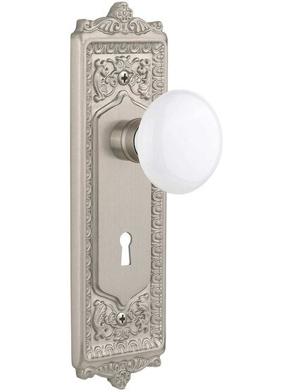 Egg and Dart Door Set with White Porcelain Knobs and Keyhole Single Dummy in Satin Nickel.